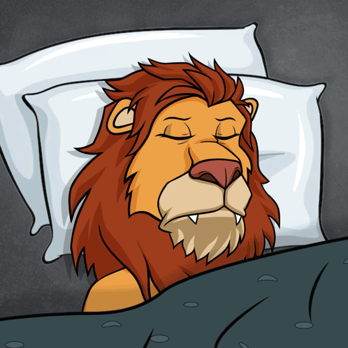 A sleepy lion lies in bed with eyes closed.