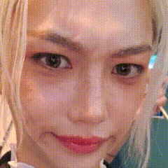 A close-up selfie shows a person staring intensely at the camera.