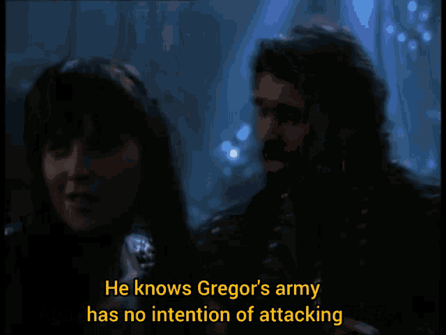 a man with a beard says give this up xena in a dark room