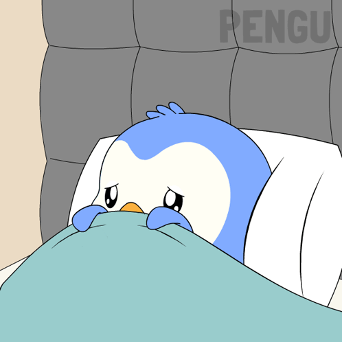 A cartoon penguin hides under a blanket in bed.