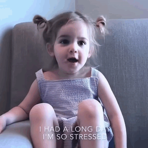 A young girl sits in a chair, captioned “I HAD A LONG DAY I’M SO STRESSED.”