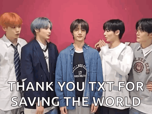 a group of young men standing next to each other with the words `` thank you txt for saving the world '' written above them .