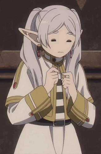 Frieren clasps her hands and looks down shyly.