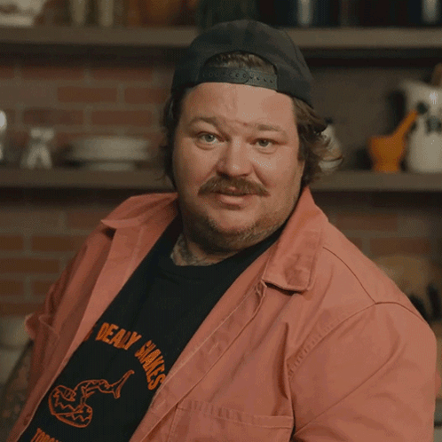 a man wearing a hat and a shirt that says " maybe i did "