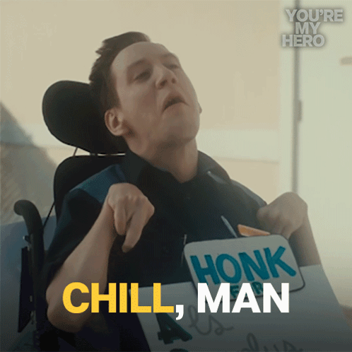 A man in a wheelchair raises his hands as text says “CHILL, MAN.”