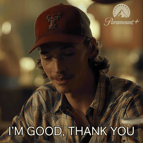a man wearing a baseball cap with the letter t on it says i 'm good thank you