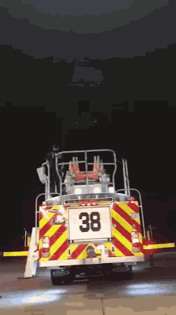 a fire truck has the number 38 on the back of it