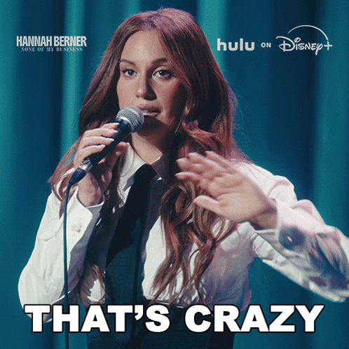 a woman singing into a microphone with the words that 's crazy on the bottom