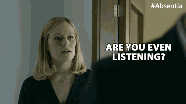 a woman says " are you even listening " next to a man in a suit
