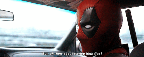 Deadpool sits in a car and raises a hand beneath “But you know about a nice high five?”