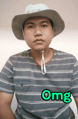 A man in a bucket hat stares forward as green text reads “Omg.”