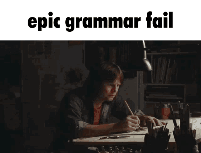 a man sitting at a desk with the words epic grammar fail