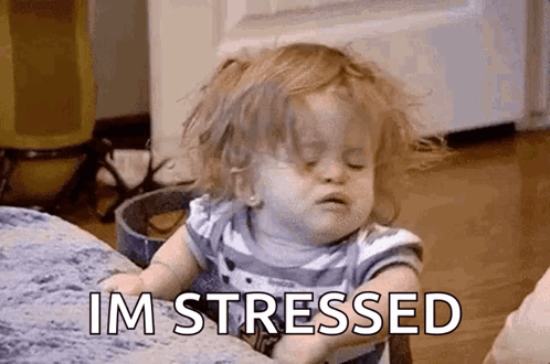 A sleepy toddler slumps forward, captioned “I’M STRESSED.”