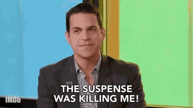 a man in a suit is saying the suspense was killing me