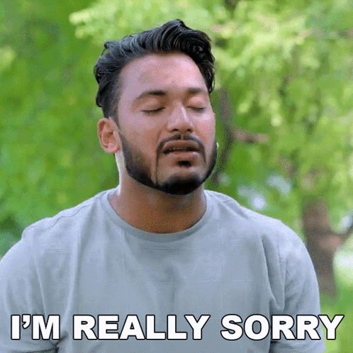 a man with a beard is saying i 'm really sorry with his eyes closed