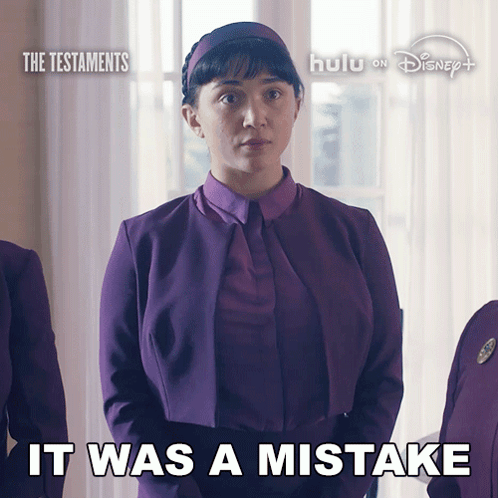 a woman in a purple suit with the words it was a mistake on the bottom