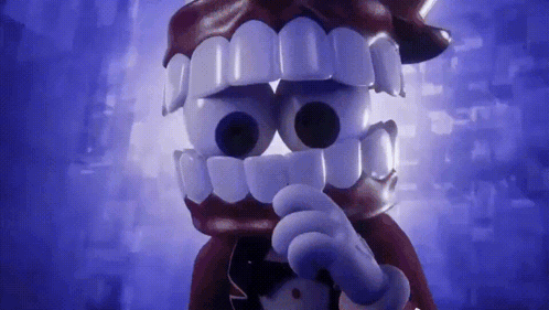 a cartoon character with big teeth and a bow tie is pointing at something .