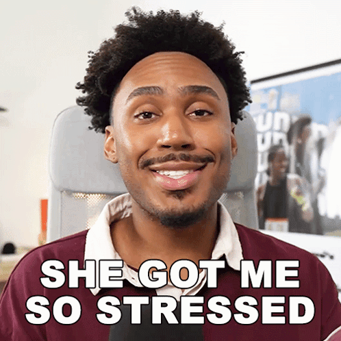 a man sitting in an airplane seat with the words she got me so stressed behind him
