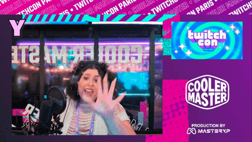 a woman giving a high five in front of a sign that says cooler master