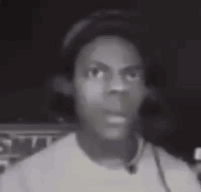 A blurry black-and-white close-up shows a startled streamer looking forward.