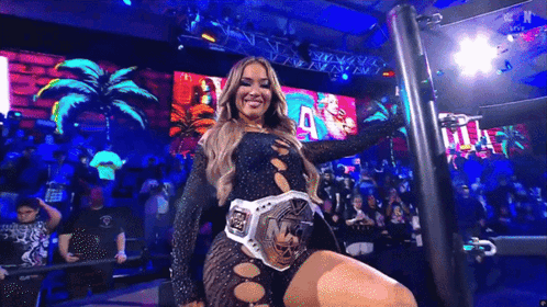 a woman in a black dress is wearing a wrestling belt that says nf