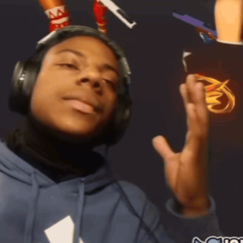 A headset-wearing streamer leans back with raised hands, looking overwhelmed.