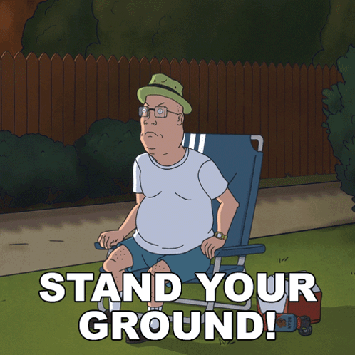 a cartoon of king billy sitting in a chair with the words stand your ground below him