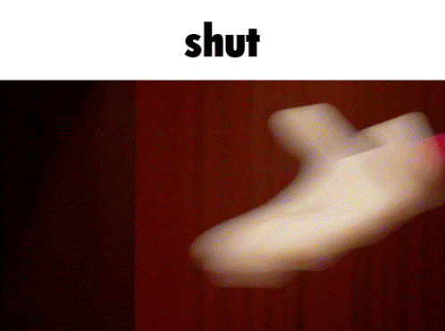 a blurred image of a person 's foot with the word shut in the corner
