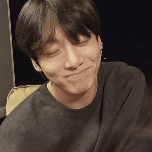 a close up of a young man making a funny face