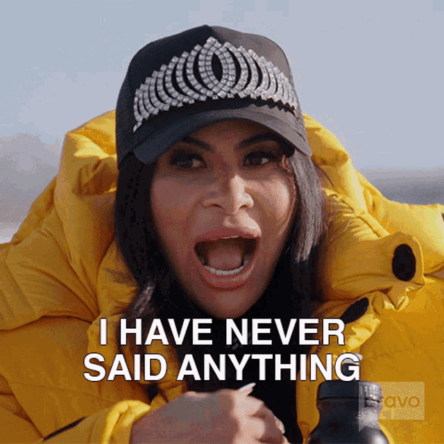 a woman wearing a yellow jacket and a black hat says i have never said anything