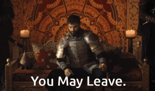 a man in armor sits on a couch with the words " you may leave " on the bottom