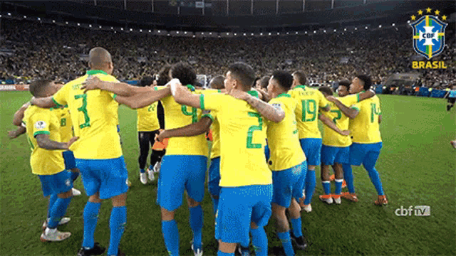 a group of soccer players are huddled together on a field with the word brasil on the bottom