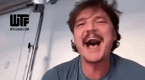 Pedro Pascal laughs and cries in a close reaction shot.