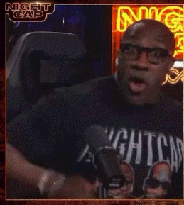 a man wearing glasses and a nightcap shirt