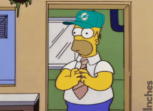 Homer Simpson stands in a doorway with his hands clasped anxiously.