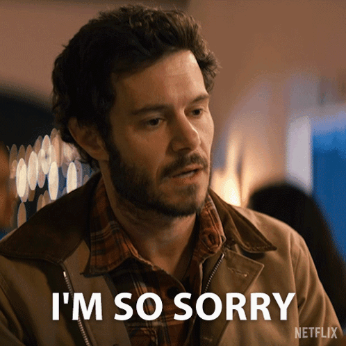 A man looks remorseful beneath “I’M SO SORRY” text from Nobody Wants This.