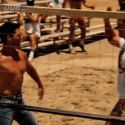 Two uniformed men run toward one another with hands raised in a Top Gun scene.