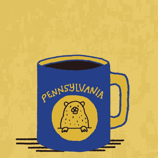 a mug that says pennsylvania on it with a groundhog on it