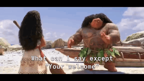 Maui gestures toward Moana on a beach as the subtitle reads ‘What can I say except you’re welcome’.