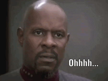 a bald man with a beard is looking at the camera and says ohhhh