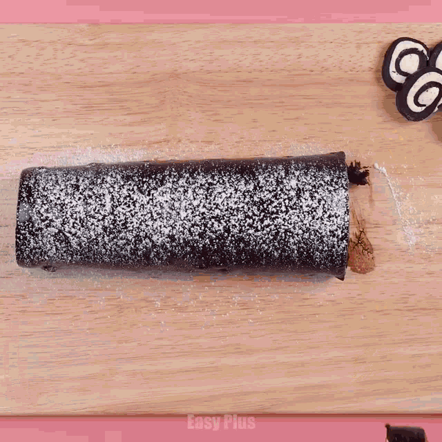 a chocolate roll with strawberries on a plate