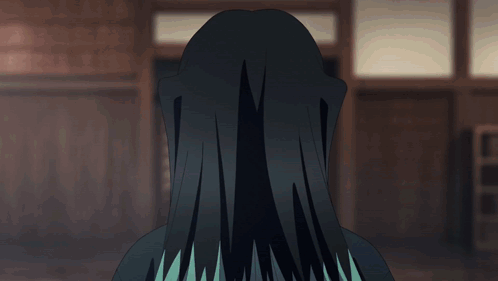 a person with long black hair and blue eyes