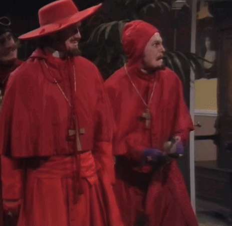 a group of men in red robes standing next to each other with the caption " our three weapons are fear and surprise "