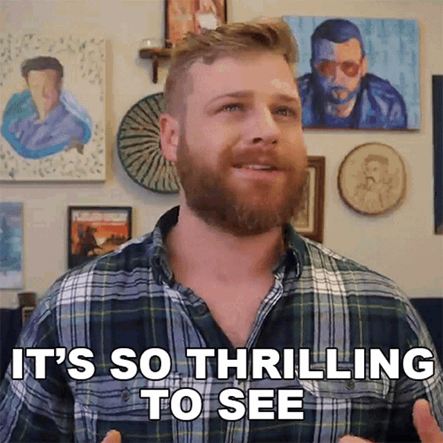 a man with a beard and plaid shirt says it 's so thrilling to see