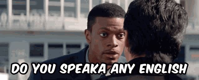 two men are talking to each other with the words `` do you speak any english '' written above them .
