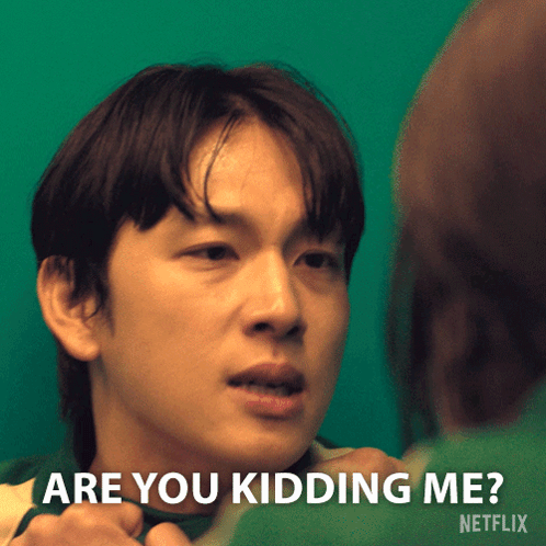a man in a green shirt says " are you kidding me " in front of a green background