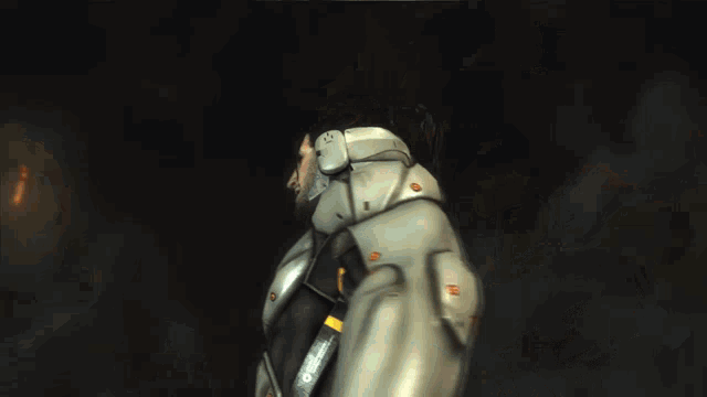 a man in a futuristic suit is standing in front of a fireball