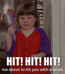 A girl in a red uniform angrily raises a brush beside the caption “HIT! HIT! HIT!”