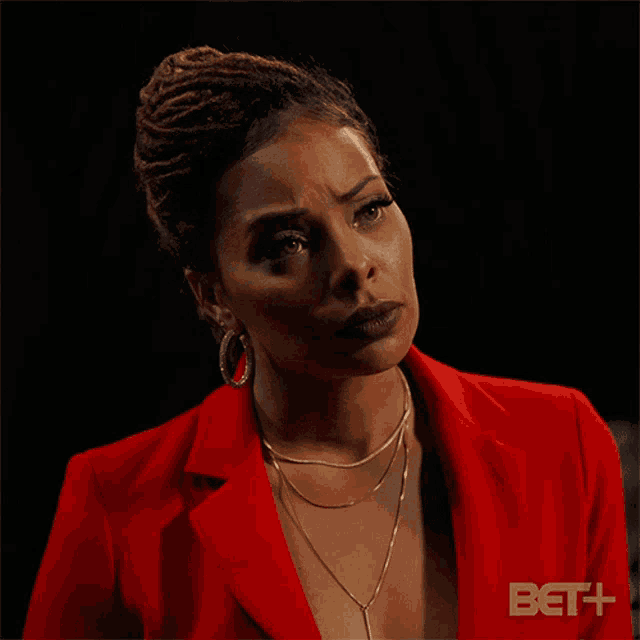 a woman in a red jacket is asking the question " maybe "