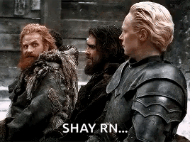 a group of men are sitting next to each other in armor and a woman is saying `` shay rn ... '' .